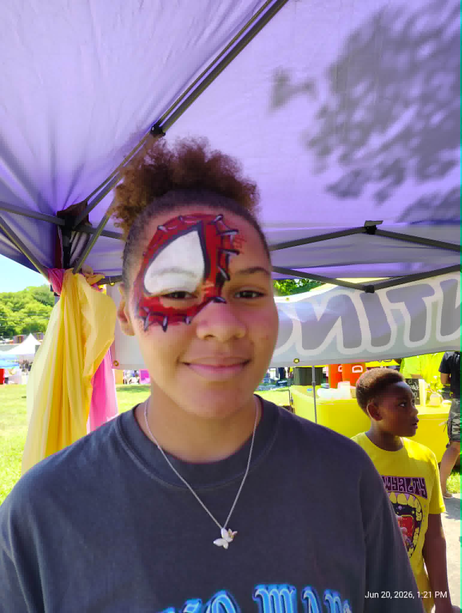 Girl with a gingerbread face painting design